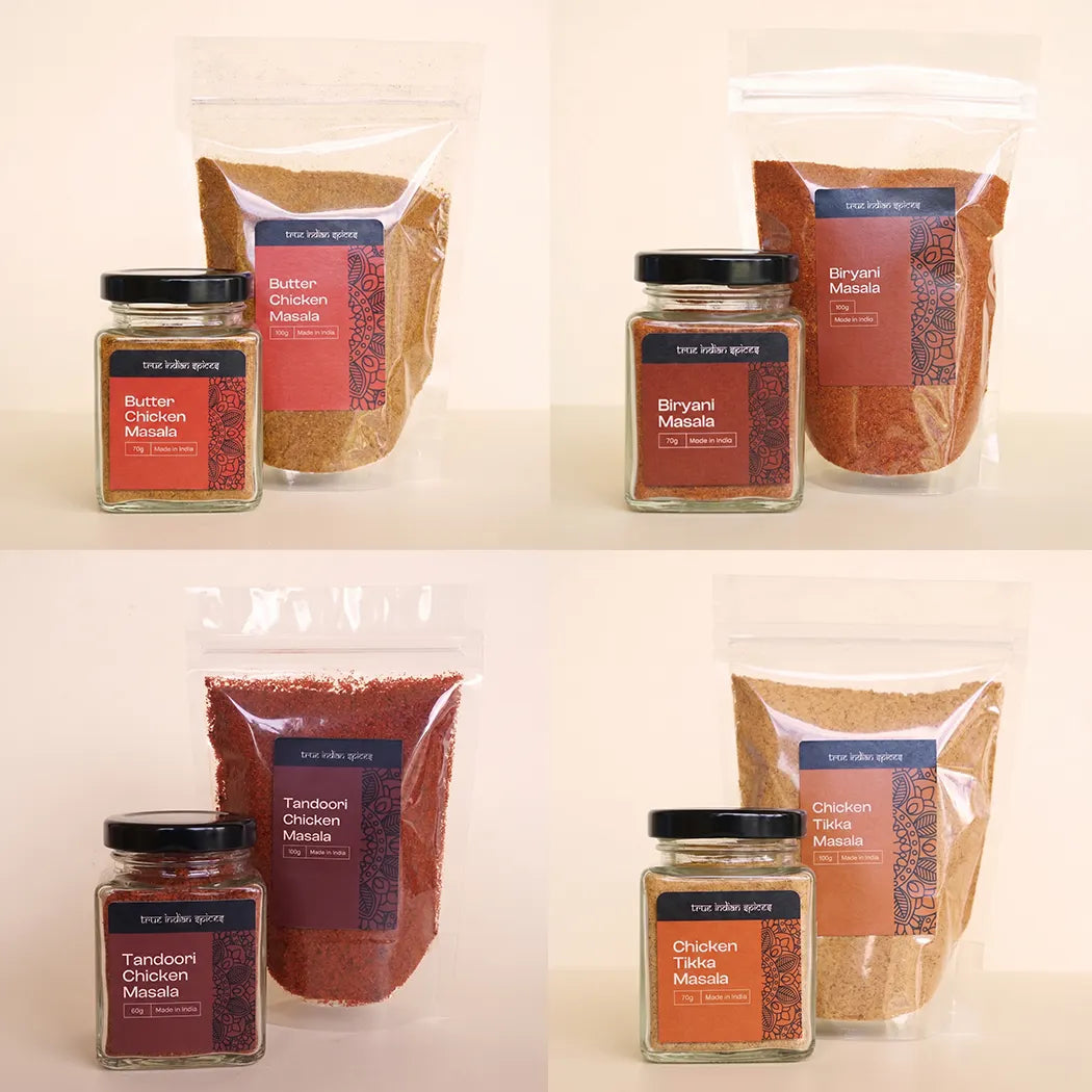 Collection of spice packs and jars with labels on a beige background
