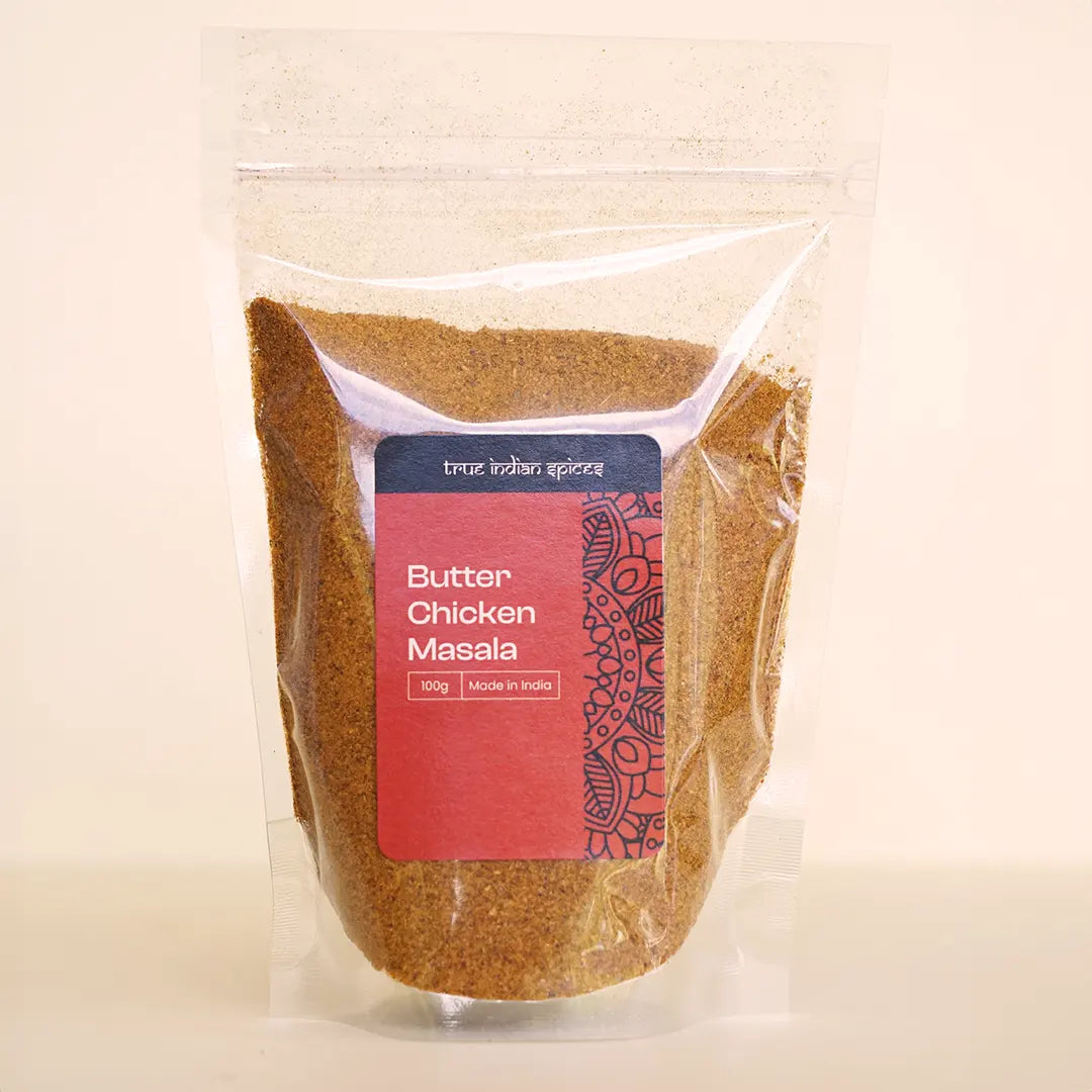 A clear resealable pouch with a label showcasing the 100g butter chicken spice mix.