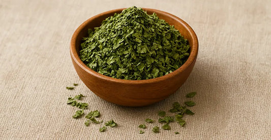 Fresh kasoori methi (dried fenugreek leaves) in wooden bowl showing vibrant green colour and authentic texture for Indian cooking