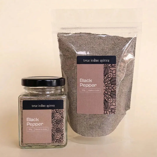 Jar and bag of black pepper with 'True Indian Spices' label on a beige background