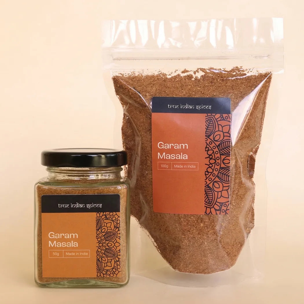 Jar and transparent packaging of Garam Masala on a beige background