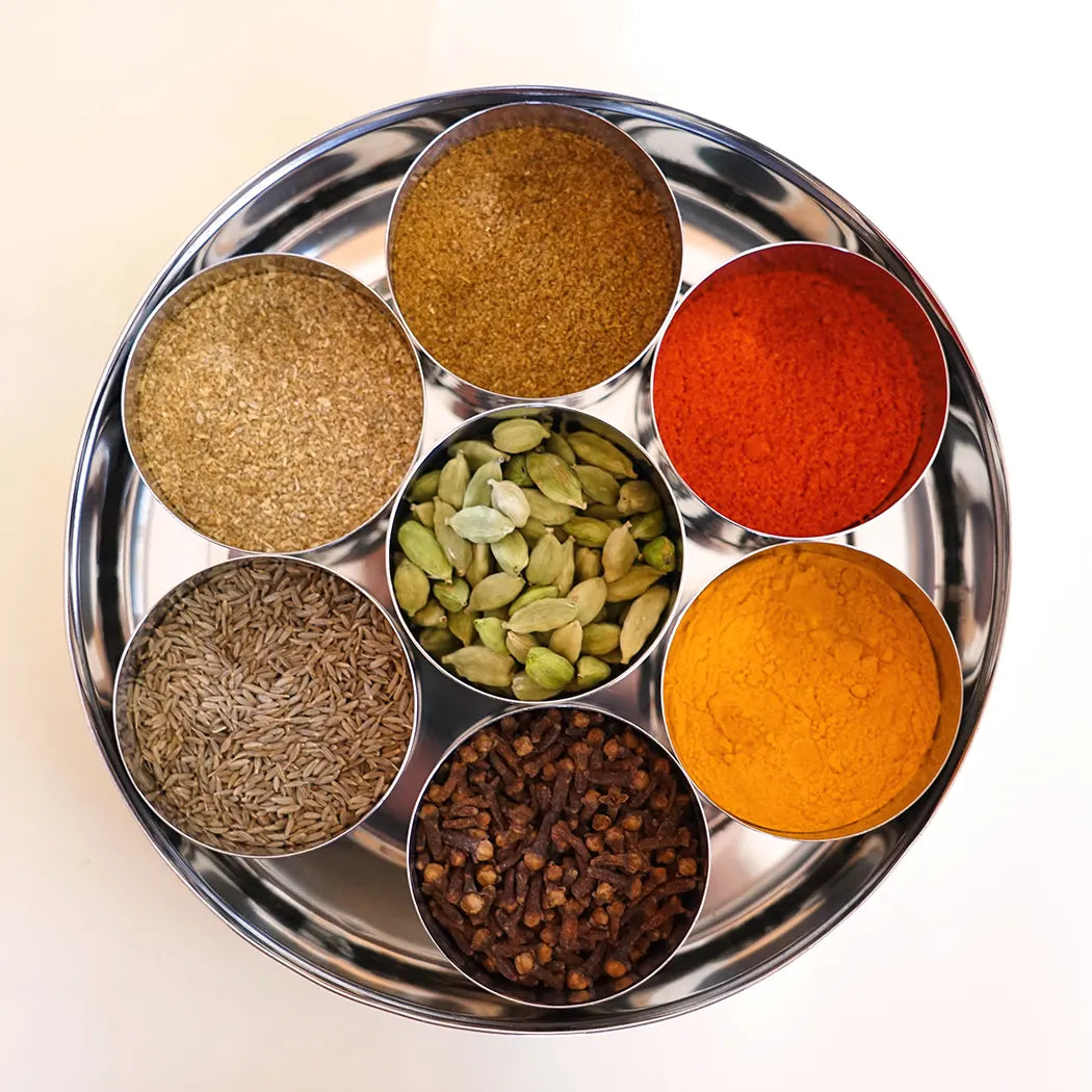 Open Masala Dabba showing 7 compartments with essential Indian spices