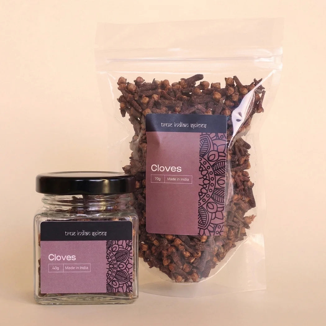 Jar and bag of cloves with purple labels on a beige background